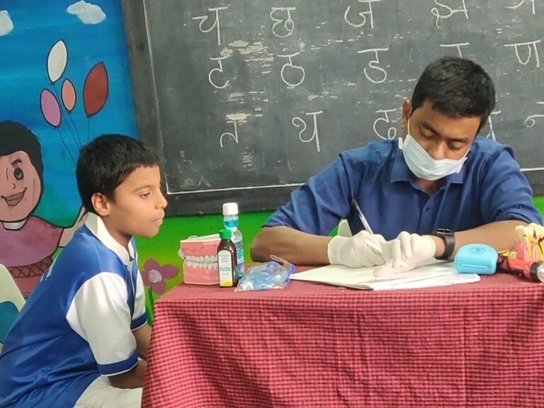 Dr G Amar Prasad conducting Free Dental Camp at Rosedale School, for Brace Dental Clinic