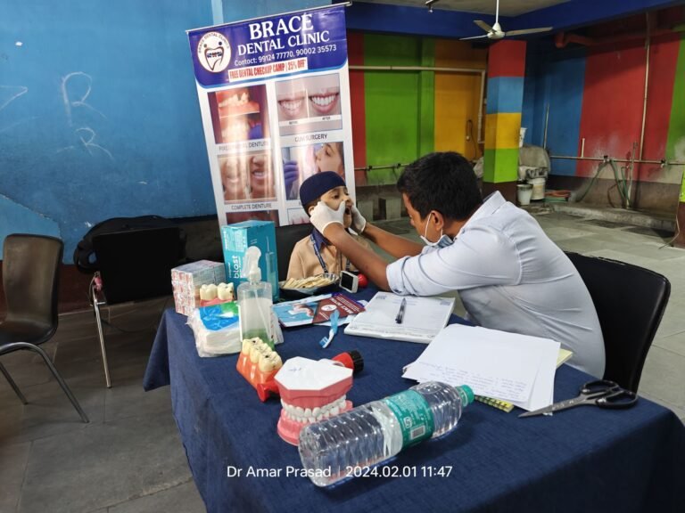 Dr G Amar Prasad doing Dental Checkup