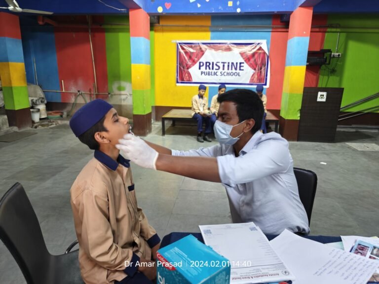 Dr G Amar Prasad doing Dental Checkup